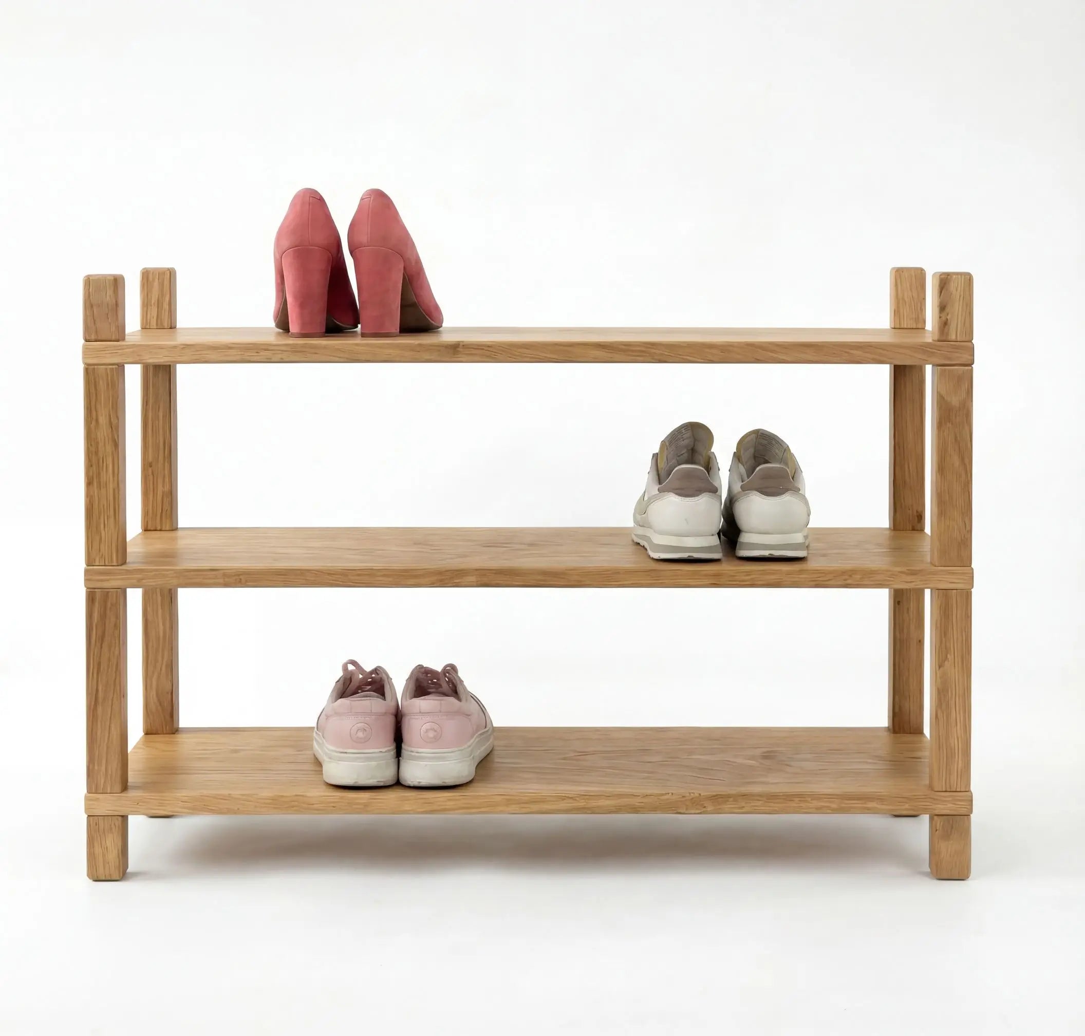Wooden shoe rack with shoes on a white background