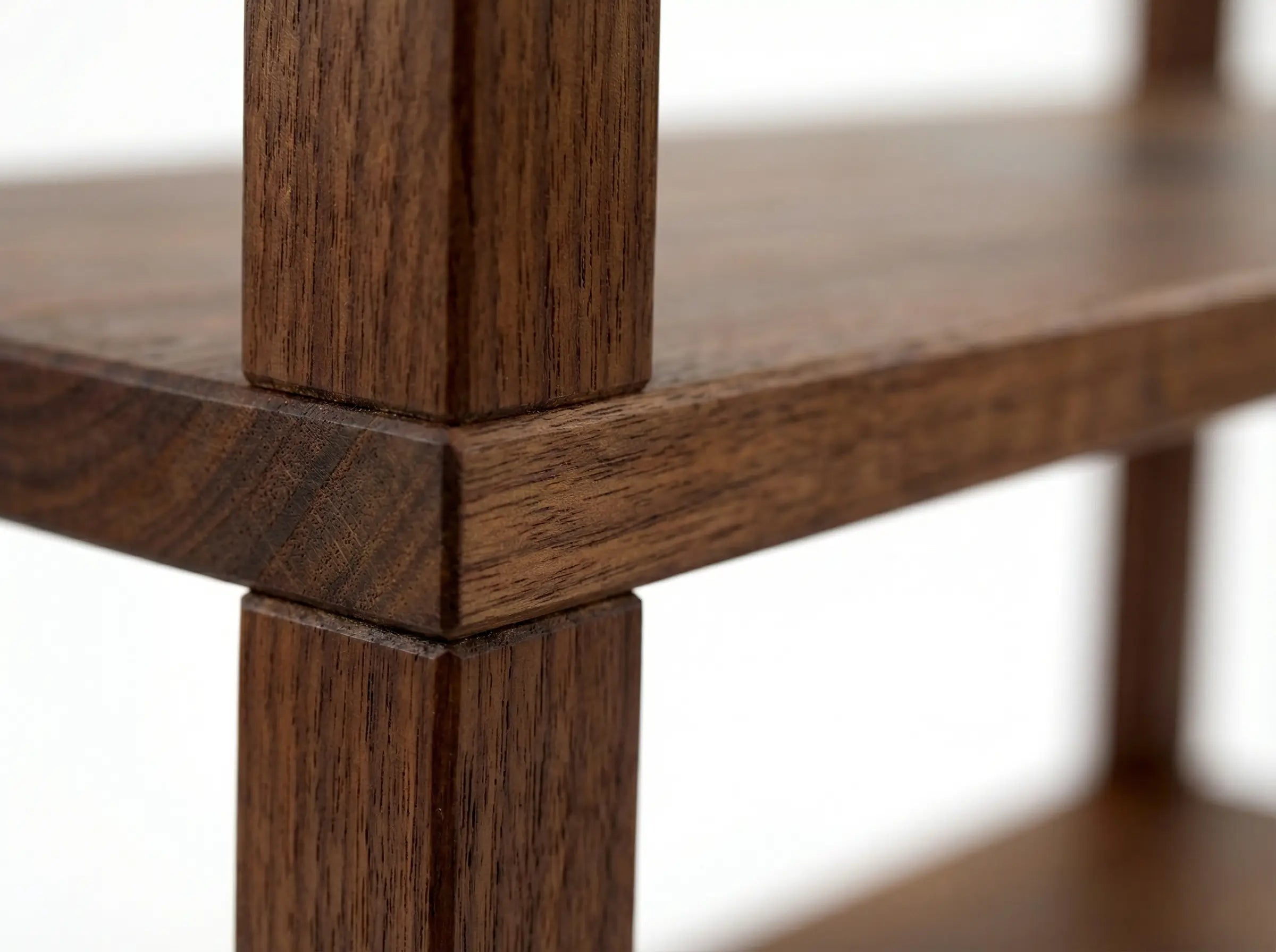 Close-up of a wooden shelf with a blurred background