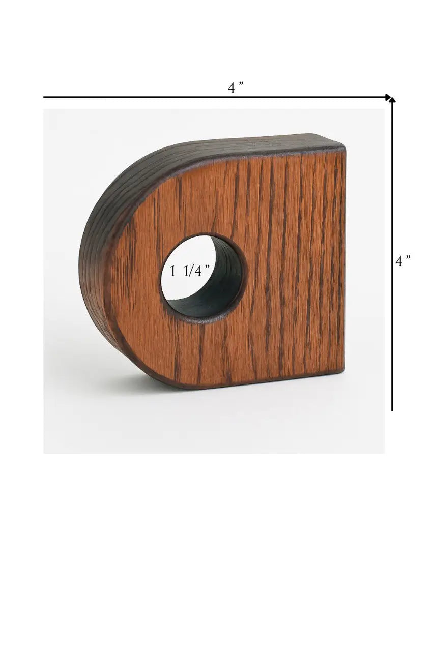 Wooden block with a circular hole and measurements on a white background