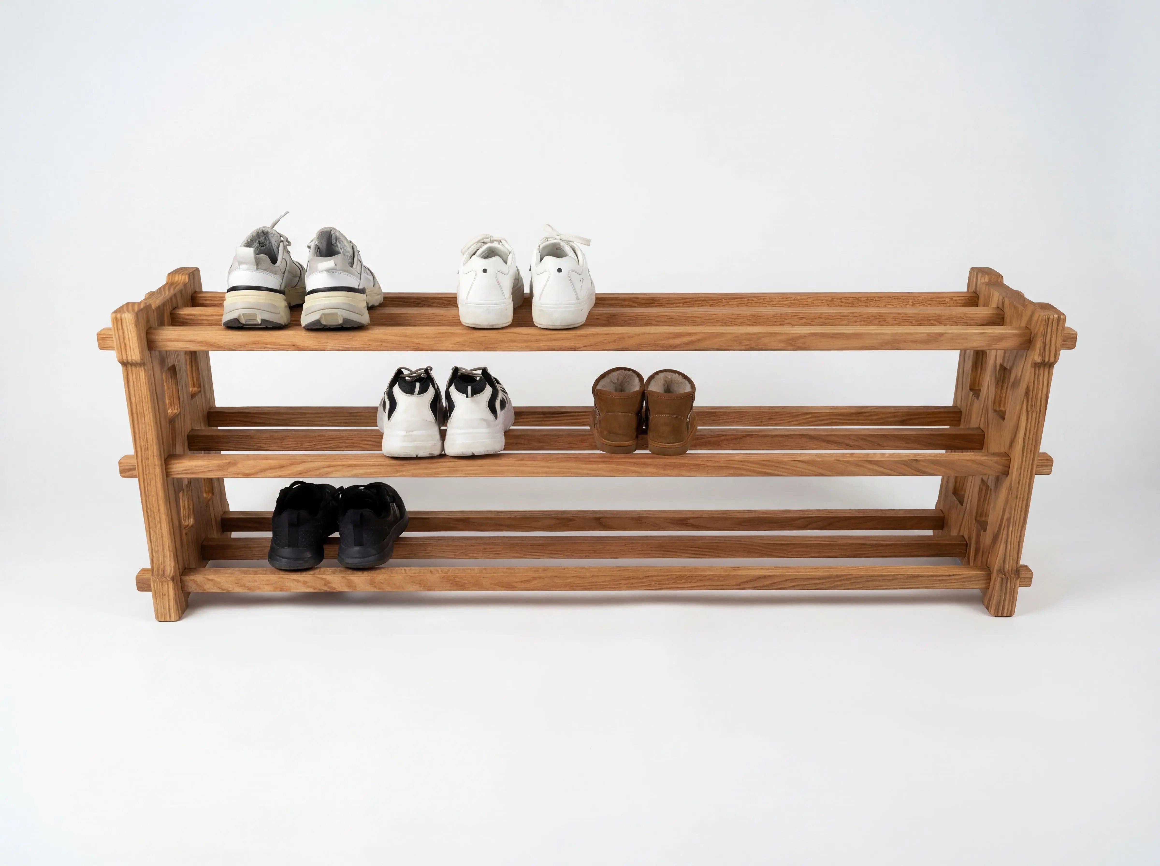 Wooden shoe rack with shoes on a white background
