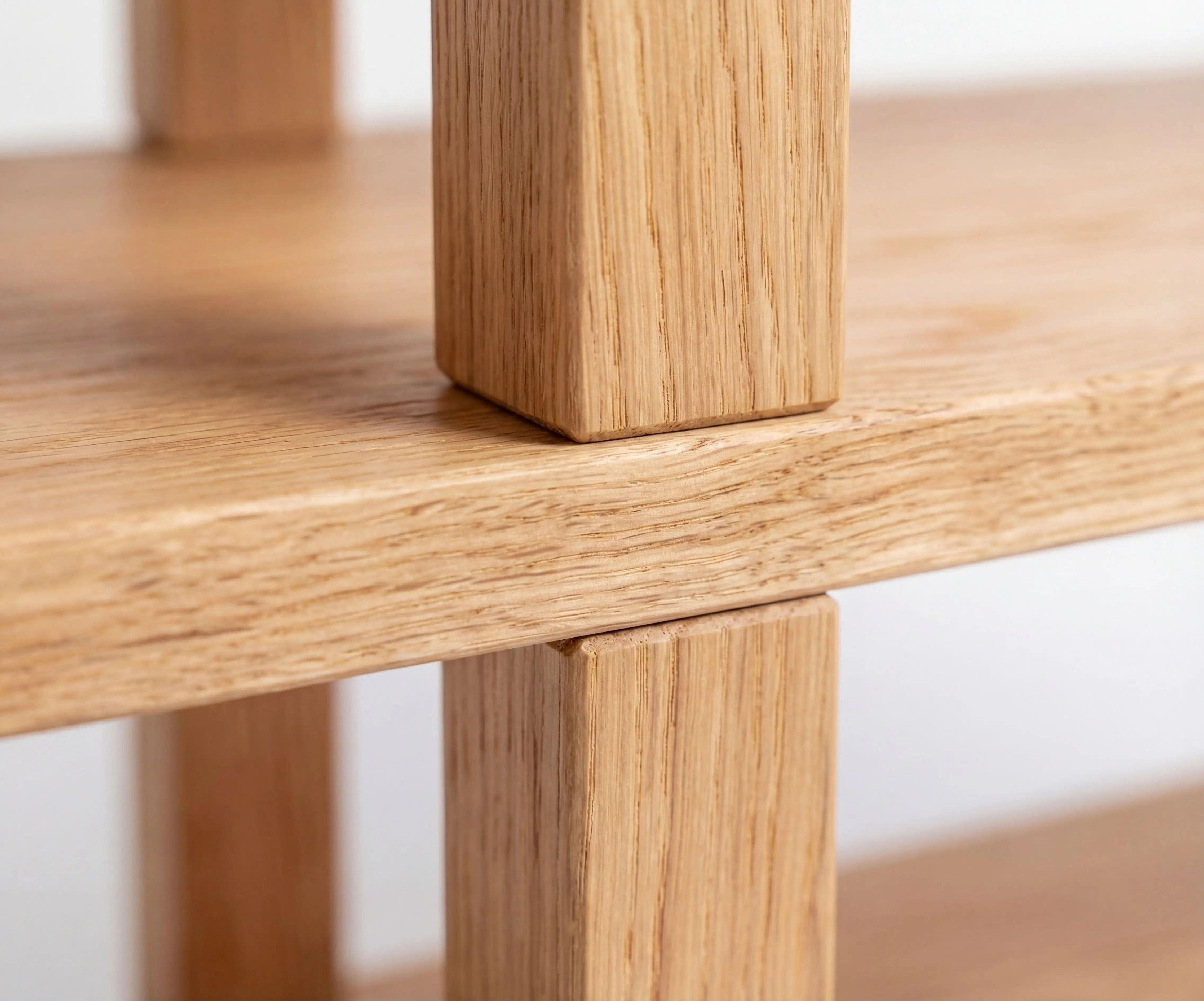 Close-up of a wooden table leg and surface