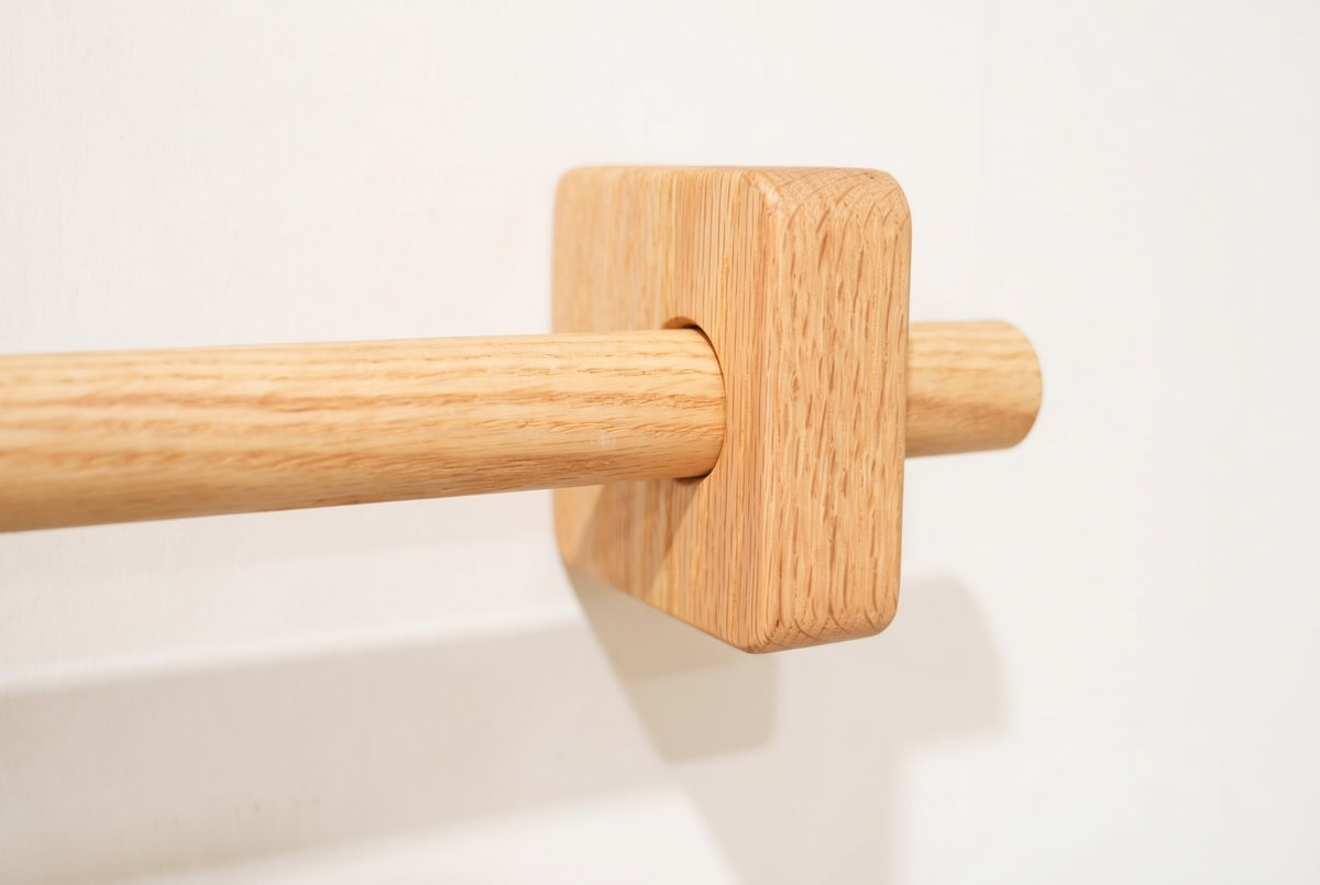 Natural | Natural oak curtain rod through a square solid oak bracket