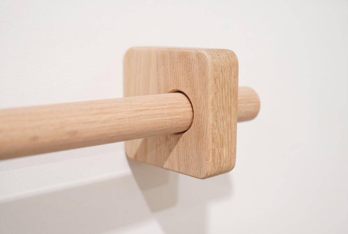 Unfinished | Unfinished sanded oak curtain rod through a square solid oak bracket