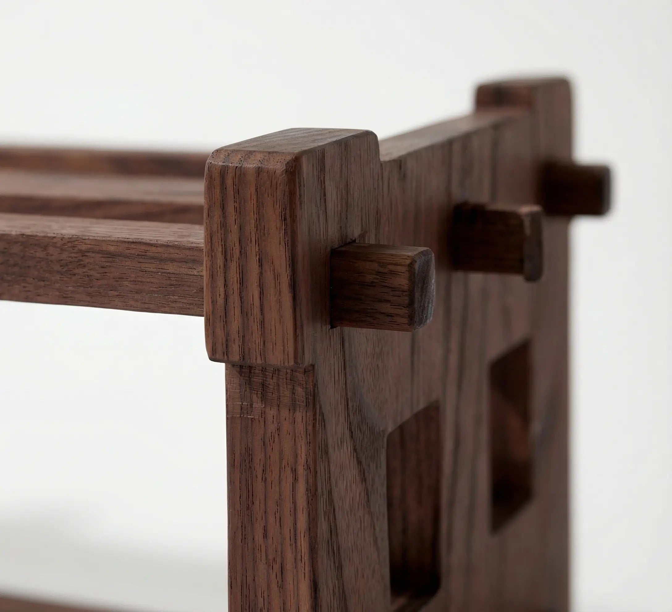 Close-up of a wooden shelf with a white background